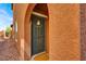 Inviting front entrance with a welcoming front door, decorative wreath, and neutral wall color at 9236 Keystone Ridge Ave, Las Vegas, NV 89148