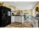An open kitchen area with wood-look floors and an adjacent dining space creates a cohesive living area at 9236 Keystone Ridge Ave, Las Vegas, NV 89148