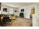 Inviting living room with plush carpet, neutral walls, and comfortable seating arrangement at 9236 Keystone Ridge Ave, Las Vegas, NV 89148