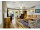 Spacious living room showcasing an open layout, wood-look floors, and comfortable seating arrangement at 9236 Keystone Ridge Ave, Las Vegas, NV 89148