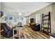 Inviting living room with comfortable seating, wood-look flooring, and nautical decor at 9236 Keystone Ridge Ave, Las Vegas, NV 89148