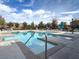 Community pool area featuring a refreshing pool, ample lounge chairs and well-maintained landscaping at 9236 Keystone Ridge Ave, Las Vegas, NV 89148