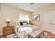 Well-lit bedroom featuring neutral colors, hardwood floors, and a window at 9413 Cedar Heights Ave, Las Vegas, NV 89134
