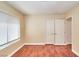 Unfurnished bedroom featuring hardwood floors, natural light, and closet storage at 9413 Cedar Heights Ave, Las Vegas, NV 89134