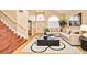 Bright living room featuring vaulted ceilings, hardwood floors, and stylish furnishings at 9413 Cedar Heights Ave, Las Vegas, NV 89134