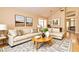 Comfortable living room featuring stylish furniture, neutral tones, and ample natural light at 9413 Cedar Heights Ave, Las Vegas, NV 89134