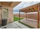 Backyard featuring an open patio, brick border, artificial turf and fully enclosed by a brick wall at 9622 Emeraude Ave, Las Vegas, NV 89147