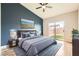Stylish bedroom with a modern design, a sliding glass door, and view of an enclosed yard at 9622 Emeraude Ave, Las Vegas, NV 89147