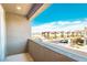 Balcony view showcasing the neighborhood and street with well-maintained lawns and landscaping at 9934 Iron Creek Ave, Las Vegas, NV 89178