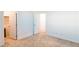 Spacious bedroom with neutral carpet, baseboards, and walk-in closet at 9934 Iron Creek Ave, Las Vegas, NV 89178