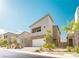 Modern two-story home with a neutral color palette and low-maintenance front yard landscaping at 9934 Iron Creek Ave, Las Vegas, NV 89178
