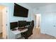 A functional office featuring multiple monitors, a comfortable chair, and ample desk space at 9934 Iron Creek Ave, Las Vegas, NV 89178