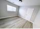Bedroom with light walls, wood look floors and a window at , Las Vegas, NV 89148