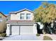 Inviting two-story home featuring a well-maintained front yard and an attached two-car garage at , Las Vegas, NV 89148