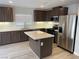 Modern kitchen with stainless steel appliances, an island, and sleek countertops at , Las Vegas, NV 89148