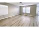 Spacious living room with lots of light and wood look floors at , Las Vegas, NV 89148