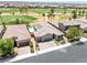 Aerial view of property featuring a sparkling pool and lush golf course views at 1129 Via Della Curia, Henderson, NV 89011