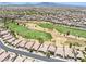 This aerial view features a community near a golf course in a desirable location at 1129 Via Della Curia, Henderson, NV 89011