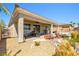 Charming outdoor living space with covered patio, fire pit, and landscape at 1129 Via Della Curia, Henderson, NV 89011