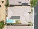Birds eye view of backyard includes a pool, firepit, covered patio, and low-maintenance landscaping at 1129 Via Della Curia, Henderson, NV 89011