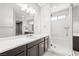 Modern bathroom featuring a walk-in shower with glass door, a vanity with great lighting at 1129 Via Della Curia, Henderson, NV 89011