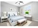 Comfortable bedroom with a ceiling fan, neutral walls, and a view to the neighborhood at 1129 Via Della Curia, Henderson, NV 89011