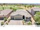 Beautiful single-story home featuring a three-car garage and lush landscaping overlooking a golf course at 1129 Via Della Curia, Henderson, NV 89011