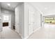 Hallway featuring doorways to a laundry room and outdoor living area at 1129 Via Della Curia, Henderson, NV 89011