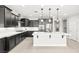 Kitchen with dark cabinets, white countertops, and stainless steel appliances at 1129 Via Della Curia, Henderson, NV 89011