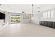 Open living room with access to outdoor living and a view of the golf course at 1129 Via Della Curia, Henderson, NV 89011