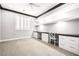 Home office featuring a built-in desk, cabinets, and neutral carpeting at 1129 Via Della Curia, Henderson, NV 89011