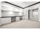 Home office with built-in desk, cabinets, and a view into another room at 1129 Via Della Curia, Henderson, NV 89011