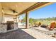 Inviting outdoor patio with built-in grill, seating area, and views at 1129 Via Della Curia, Henderson, NV 89011