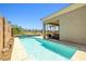 Relaxing backyard pool with view of golf course and covered patio is perfect for summer at 1129 Via Della Curia, Henderson, NV 89011
