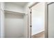 Walk-in closet with a single rod for hanging clothes and wood-look floors at 1144 Calico Ridge Dr, Henderson, NV 89011