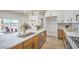 Bright kitchen featuring an island with bar seating and modern stainless appliances at 1144 Calico Ridge Dr, Henderson, NV 89011