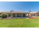 Beautiful backyard with mature shrubbery and well-maintained lawn at 1195 Golf Club Dr, Laughlin, NV 89029
