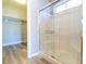 Bathroom featuring glass shower doors and a walk-in closet with shelving at 1195 Golf Club Dr, Laughlin, NV 89029