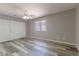 Bright bedroom with contemporary flooring, a ceiling fan, and ample closet space at 1195 Golf Club Dr, Laughlin, NV 89029