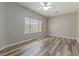 Spacious bedroom featuring new wood flooring, neutral paint and plenty of natural light at 1195 Golf Club Dr, Laughlin, NV 89029