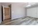 Neutral bedroom featuring modern flooring, a ceiling fan, and a closet with sliding doors at 1195 Golf Club Dr, Laughlin, NV 89029