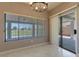 Sunlit dining area with a chandelier and sliding glass doors to the outdoor patio at 1195 Golf Club Dr, Laughlin, NV 89029