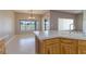 View of kitchen featuring an island and wood cabinetry with a window overlooking the golf course at 1195 Golf Club Dr, Laughlin, NV 89029