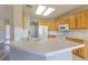 Bright kitchen with updated cabinets and countertops, lots of natural light and stainless steel appliances at 1195 Golf Club Dr, Laughlin, NV 89029