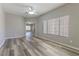 Open-concept living space showcasing new wood flooring and lots of natural light at 1195 Golf Club Dr, Laughlin, NV 89029