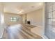 Bright living room with a cozy fireplace, neutral paint and new wood flooring at 1195 Golf Club Dr, Laughlin, NV 89029