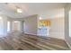 Open-concept living room featuring new wood flooring and easy access to the kitchen at 1195 Golf Club Dr, Laughlin, NV 89029