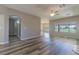 Open-concept living space showcasing new wood flooring and lots of natural light at 1195 Golf Club Dr, Laughlin, NV 89029