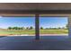Covered patio looks out to the community golf course with clear blue skies at 1195 Golf Club Dr, Laughlin, NV 89029