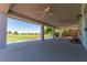 Large covered patio with ceiling fans offers golf course views for outdoor living and entertaining at 1195 Golf Club Dr, Laughlin, NV 89029